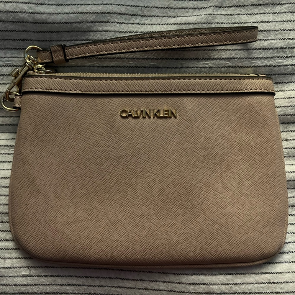 Calvin Klein wristlet- blush pink. In good condition.